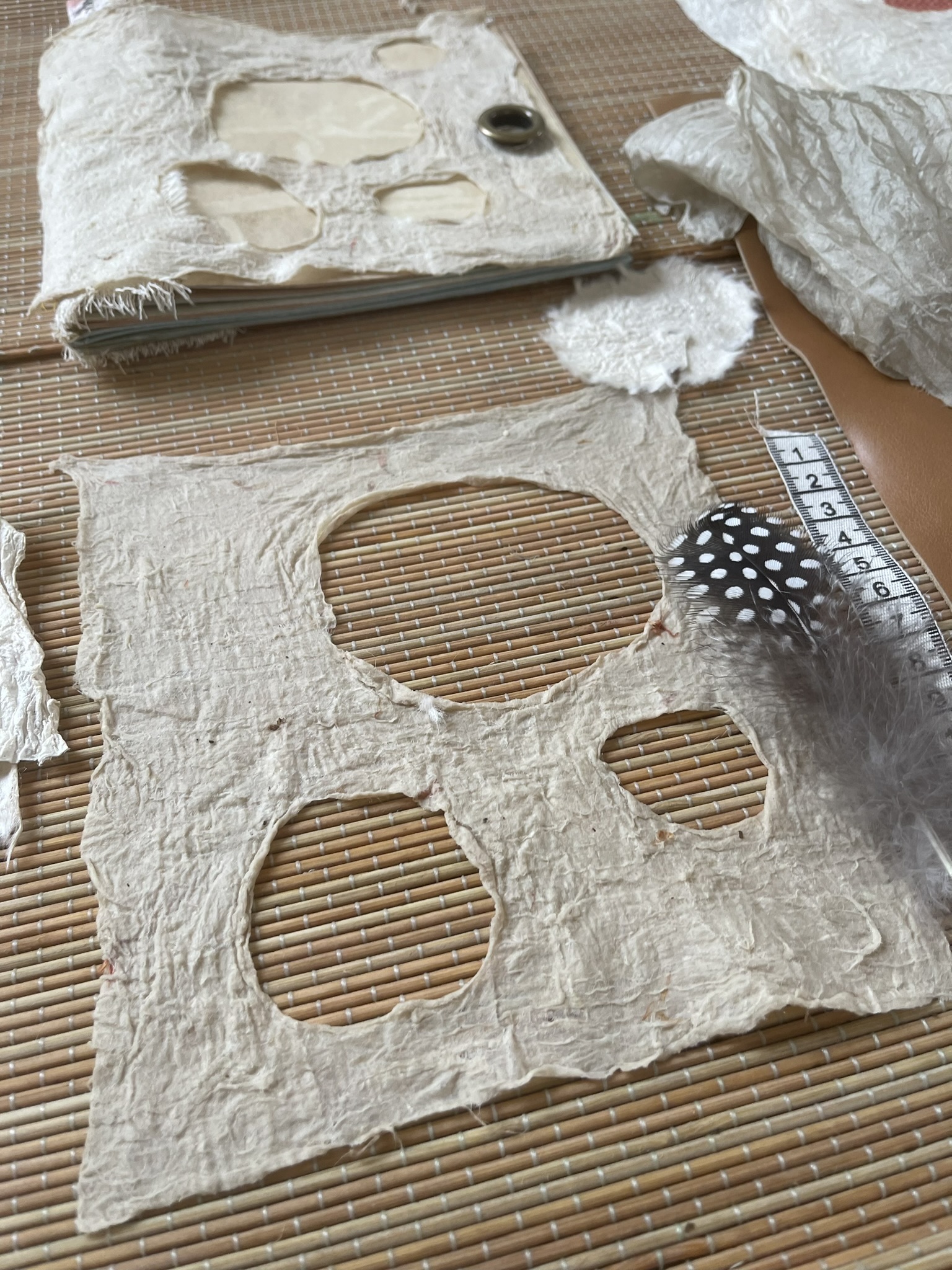 Finished artistic Joomchi wall hanging with intricate holes and lace-like texture
